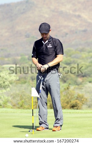 GIOVINAZZO , CARMINE  - NOVEMBER 17: Actor Guest Player Playing at Gary Player Charity Invitational Golf Tournament  November  17, 2013, Sun City, South Africa. Carmine on practice green.