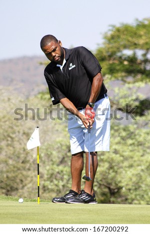 ANDERSON,  ANTHONY  - NOVEMBER 17: Actor Guest Player at Gary Player Charity Invitational Golf Tournament  November  17, 2013, Sun City, South Africa. Anthoney on practising green before tee-off.