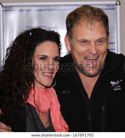 RUSTENBURG, SOUTH AFRICA - JULY 26: Singer, Songwriter and Actor, Steve Hofmeyr on July 26, 2013, Rustenburg, South Africa.  Actor laughing with fiance Janine van der Vyver.