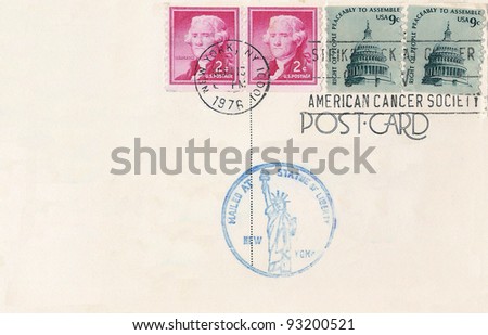 USA - CIRCA 1976: Stamps printed in USA on postcard with Statue of Liberty Stamp  shows Jefferson and Capital Building, circa 1976