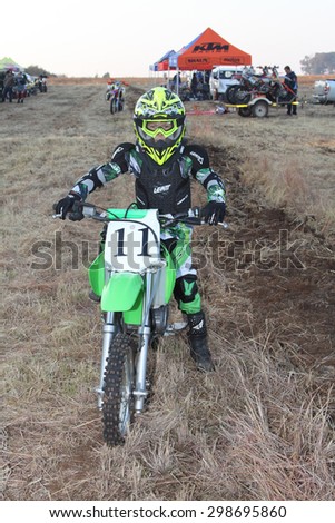BRITS, SOUTH AFRICA - July 11:  Africa-Offroad Racing Rally,  on July 11, 2015 at Koster, North West Province, South Africa.  Junior motorbike rider posing on motorbike.