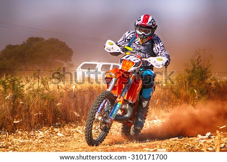 KOSTER, SOUTH AFRICA - July 11:  Africa-Offroad Racing Rally,  on July 11, 2015 at Koster, North West Province, South Africa.  HD - Motorbike kicking up trail of dust on sand track during rally race.