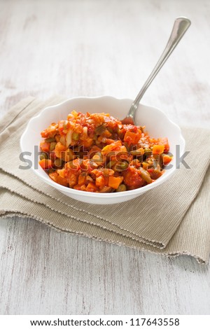 Bowl of cooked veggie, carrots, tomatoes, and more