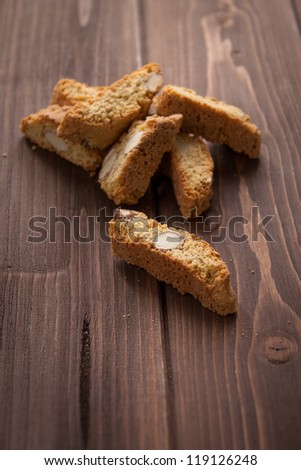 Typical italian cookies Cantucci on wood table
