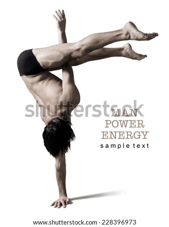 Athlete.Power.Energy.Gym,Athletic male figure on a white background.Circus actor stand on one hand .Sepia.