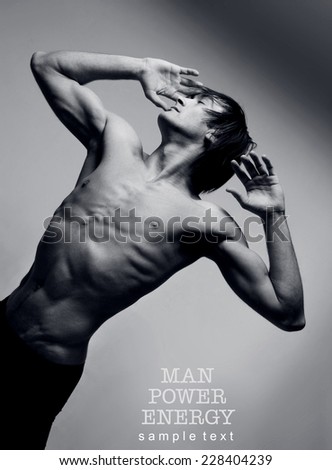 Athlete.Power.Energy.Gym.Athletic male figure on a gray background.Black-and-white image