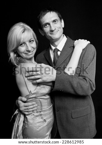 happy couple on a black background.man and woman.family holiday.Black-and-white image.