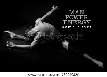 Athlete.Power.Energy.Gym.Men's sports figure on a black background.Black-and-white image