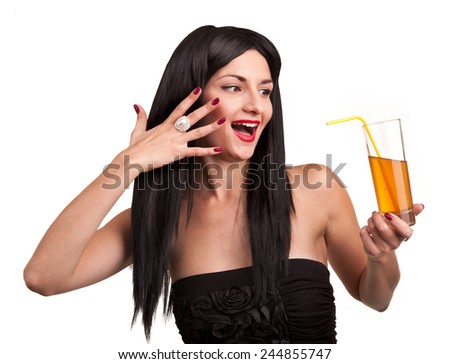Emotional cheerful girl with a glass of drink.Model on a white background.