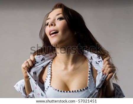 women's emotions.excited happy woman on a gray background