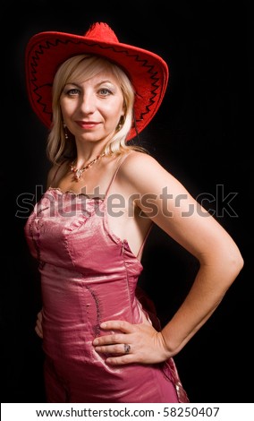 woman in an evening dress and red hat on a black background.