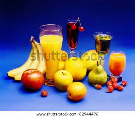 juices, drinks, fruit  on a blue background.harvest.healthy way of life