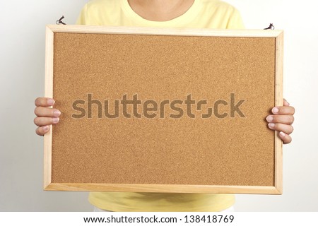 people holding a cork board, leave your messages or inform on the cork board
