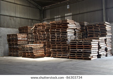 the old wooden pallets stacked at warehouse