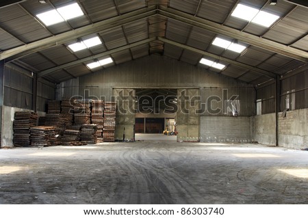 Rusty old pallets in abandoned warehouse
