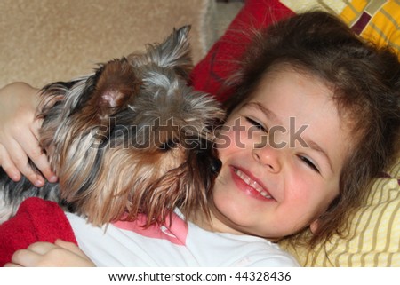 stock photo dog kissing baby girl
