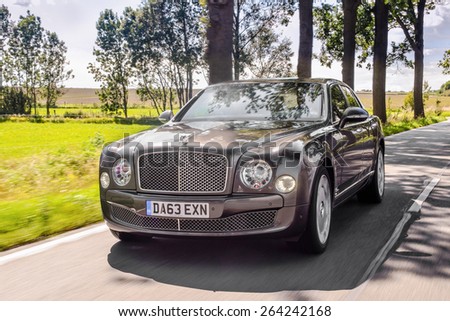 BERLIN CIRCA AUGUST 2014: Bentley Mulsanne drives along the road during the test drive event for automotive journalists from Eastern Europe.