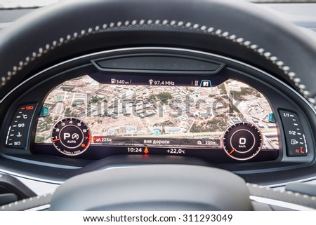 MINSK, BELARUS - AUGUST 28, 2015: 2015 model year all-new Audi Q7 3.0 TFSI 12.3-inch virtual cockpit digital dashboard with navigation map on display at test drive event for automotive journalists.