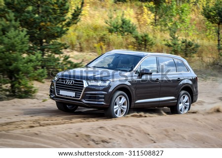 MINSK, BELARUS - AUGUST 28, 2015: 2015 model year all-new Audi Q7 3.0 TFSI goes off-road the test drive in Minsk, Belarus. Audi Q7 SUV is powered by 3.0 liter supercharged engine (333 hp).