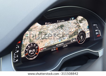 MINSK, BELARUS - AUGUST 28, 2015: 2015 model year all-new Audi Q7 3.0 TFSI 12.3-inch virtual cockpit digital dashboard with navigation map on display at test drive event for automotive journalists.