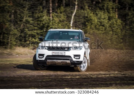 MINSK, BELARUS - APRIL 6, 2014: 2015 model year Range Rover Sport 3.0 Supercharged goes off-road. British SUV is powered by 3.0 liter V6 (340 hp & 450 Nm).