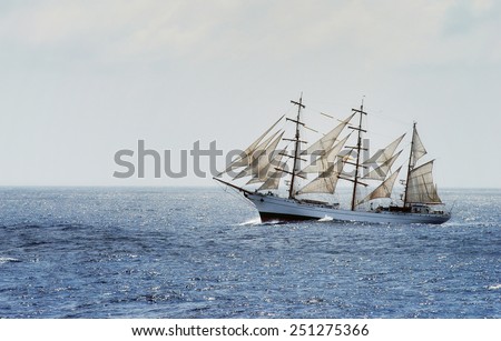 Traditional sailing ship cross from Mediterranean sea to Atlantic ocean during rough sea and  strong wind.
