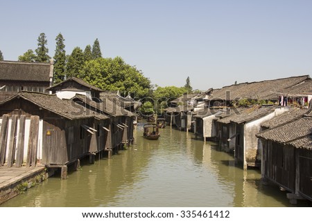 River path running through Wuzhen\'s residential buildings in east China