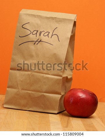 A brown lunch bags prepared specially for Sarah.