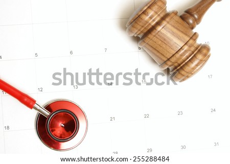 A connection of two forces of medicine and law on top of a calendar.