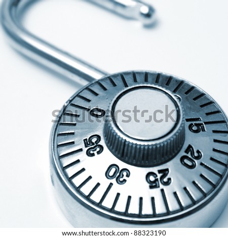 A combination lock that you would use to protect your valuables in square format and in blue tint.