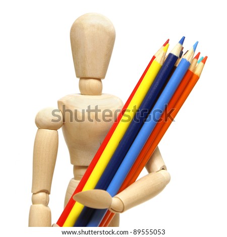 A wood mannequin holds a pencil crayons for the artist.