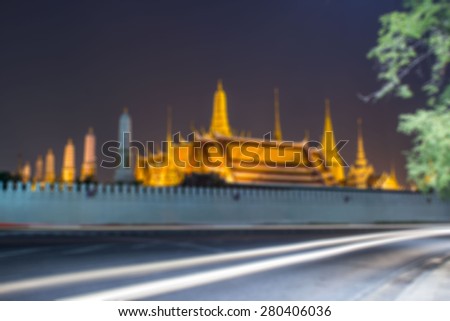 Blurry Cityscape of Wat Phra Kaew at night and street, bangkok, Thailand.