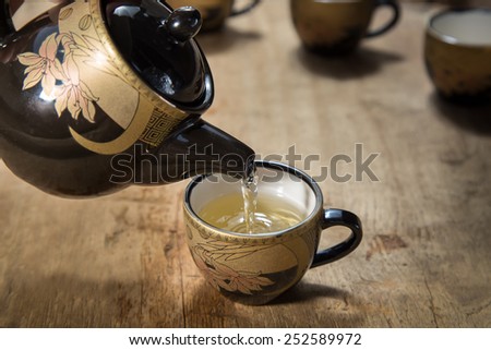 teapot and mug on old wood table
