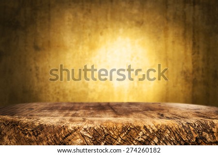 wooden desk and dark yellow background