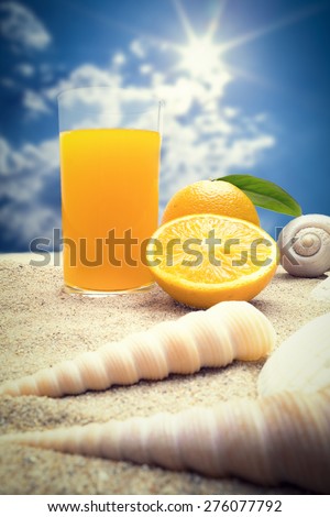 summer orange juice on beach side