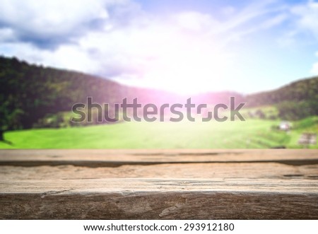 wooden desk space sunny day with landscape