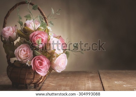 Still life with roses on wood desk vintage