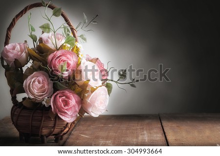 Still life with roses on wood desk vintage