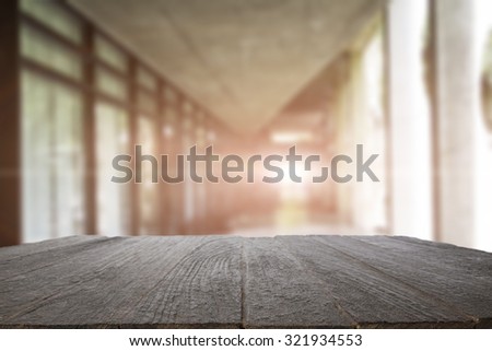 Space of wood table platform and atmosphere around office blur background for product presentation.