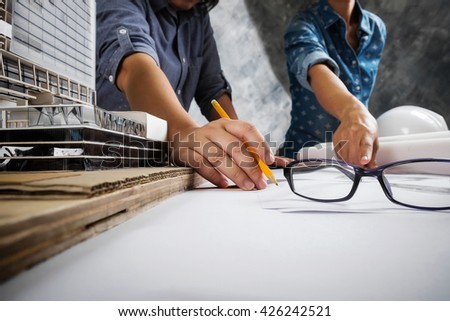Engineer teamwork. Image of engineer meeting for architectural project. working with partner and engineering tools on workplace.
