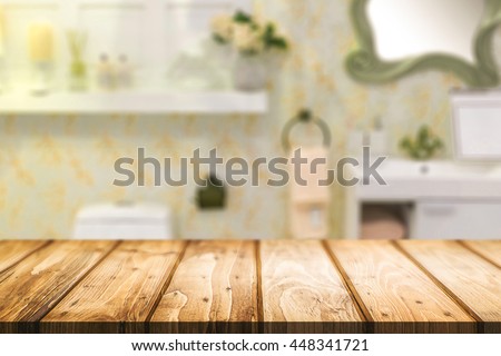 Wood desk free space over bathroom background for product display. Business presentation.