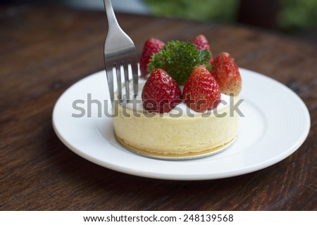 strawberry cake on wood table