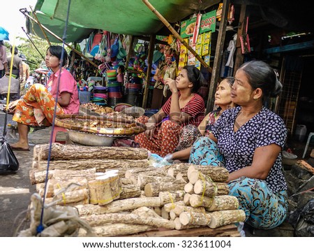 YANGON, MYANMAR - Circa NOVEMBER 2014 - In a local market in Yangon, Myanmar, lady vendors were selling herb \