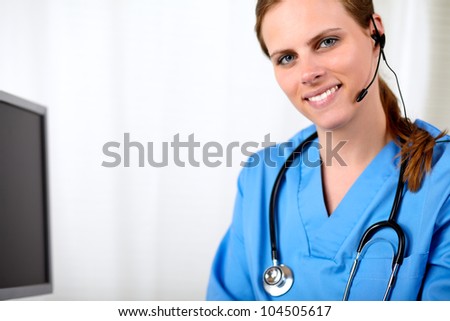 Portrait of a beautiful blonde medical secretary smiling at hospital