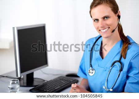 Portrait of a caucasian medical secretary smiling at hospital callcenter