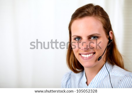Close up portrait of a professional receptionist smiling at customer service office
