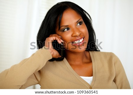Portrait of a stylish young woman conversing on cellphone
