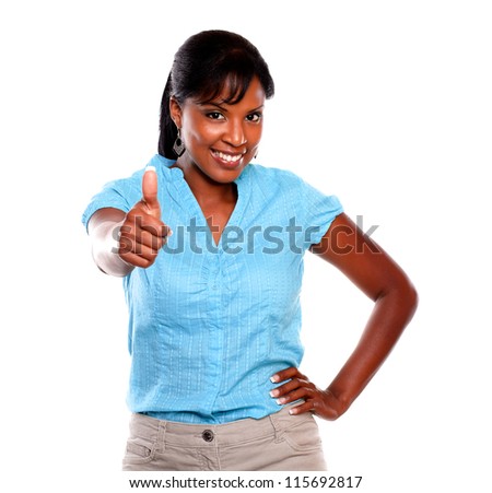 Friendly young woman saying great job on blue shirt against white background