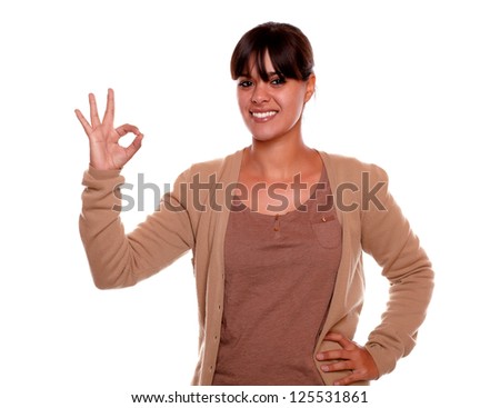 Portrait of a smiling young woman with fringes saying at you great job on isolated background