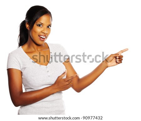 Portrait of a young pretty black woman pointing with the fingers.